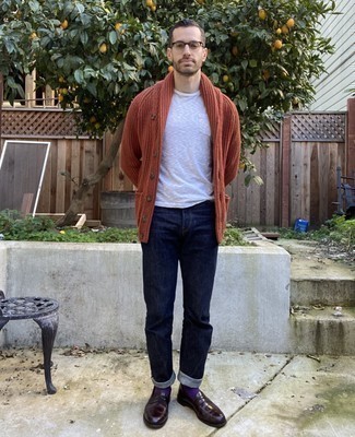Burgundy Leather Loafers Outfits For Men: This casual pairing of an orange shawl cardigan and navy jeans is capable of taking on different nuances depending on the way you style it out. Complete your look with a pair of burgundy leather loafers to shake things up.