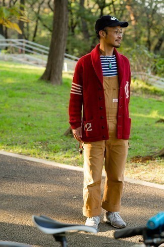 Red Cardigan Warm Weather Outfits For Men: Dress in a red cardigan and khaki denim overalls for a casual outfit with a twist. For a more casual feel, introduce beige athletic shoes to the mix.