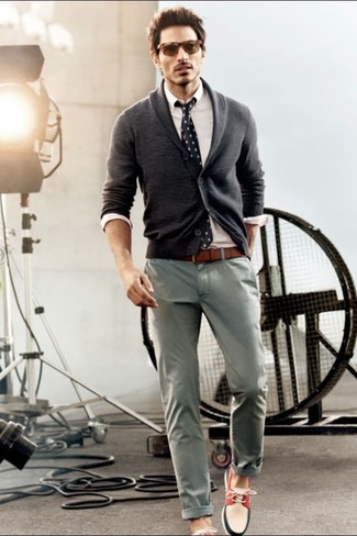 White and Red and Navy Leather Boat Shoes Outfits: A smart pairing of a charcoal shawl cardigan and grey chinos is appropriate in many different situations. Feeling brave today? Switch up your look by wearing white and red and navy leather boat shoes.