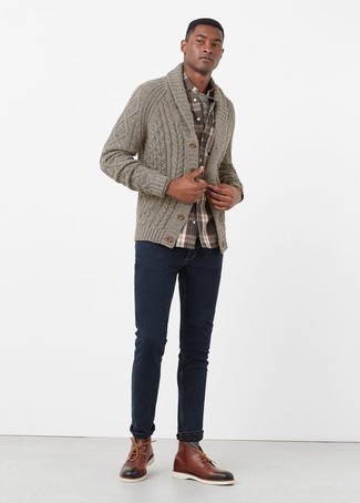 A grey shawl cardigan and navy jeans matched together are the ideal getup for gents who love off-duty outfits. Now all you need is a pair of burgundy leather desert boots.
