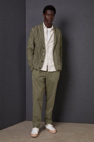 Olive Chinos Outfits: No matter where the day takes you, you can always rely on this relaxed casual combo of an olive knit shawl cardigan and olive chinos. White canvas low top sneakers will create a stylish contrast against the rest of the outfit.