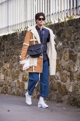 Tan Shearling Coat Outfits For Men: This casual combo of a tan shearling coat and navy jeans is super easy to pull together in seconds time, helping you look amazing and prepared for anything without spending a ton of time rummaging through your closet. A pair of white athletic shoes instantly ups the fashion factor of your look.