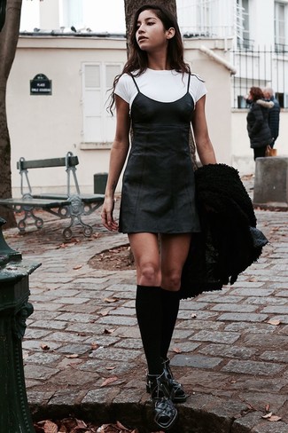 Black Leather Cami Dress Outfits: Try teaming a black leather cami dress with a black shearling jacket for a straightforward outfit that's also pieced together nicely. Look at how nice this ensemble goes with a pair of black cutout leather ankle boots.