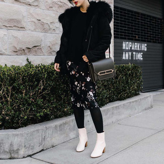 White Leather Ankle Boots Outfits: If you like comfort dressing, dress in a black shearling jacket and a black floral pencil skirt. If not sure as to the footwear, introduce white leather ankle boots to the equation.