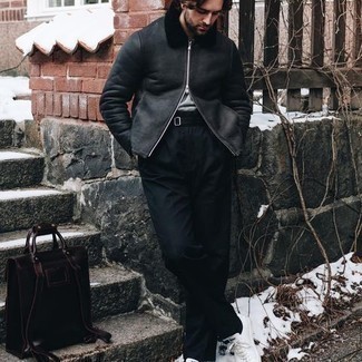 Black Shearling Jacket Outfits For Men: This combination of a black shearling jacket and black dress pants is great for dressier occasions. Round off this getup with a pair of white canvas low top sneakers for a truly modern hi-low mix.