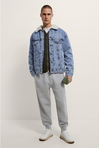 Grey Sweatpants Outfits For Men: Make a light blue denim shearling jacket and grey sweatpants your outfit choice for a functional menswear style that's also put together nicely. White leather low top sneakers complete this outfit very nicely.