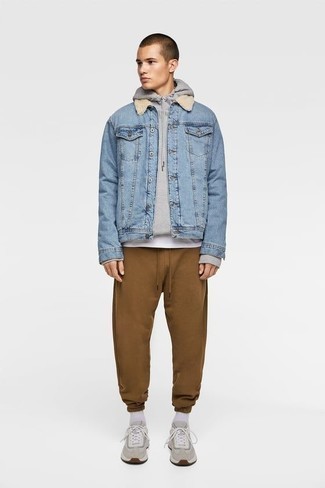 Sweatpants Outfits For Men: A light blue denim shearling jacket and sweatpants make for the ultimate off-duty style for today's gent. Not sure how to finish? Complete your ensemble with grey athletic shoes to mix things up.