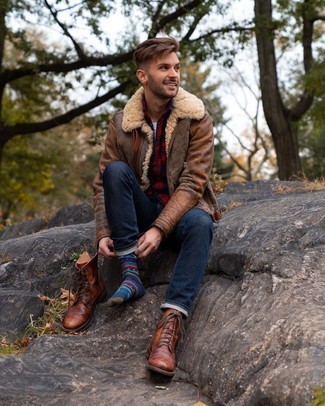 500+ Winter Outfits For Men: For an ensemble that's pared-down but can be worn in a great deal of different ways, opt for a brown shearling jacket and navy jeans. Jazz up this outfit by rounding off with brown leather casual boots. In winter, when practicality is essential, it can be easy to surrender to a less-than-stylish look in the name of practicality. But this look is hard proof that you totally can stay comfy and remain equally stylish in winter.