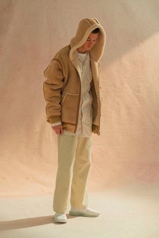 Tan Shearling Jacket Outfits For Men: Perfect the casual and cool ensemble in a tan shearling jacket and beige chinos. Want to go easy in the footwear department? Add a pair of white athletic shoes to the mix for the day.