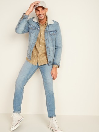 Light Blue Denim Shearling Jacket Outfits For Men: A light blue denim shearling jacket and light blue jeans will inject extra style into your current casual lineup. Add white canvas high top sneakers to the equation to make an all-too-safe ensemble feel suddenly fresh.