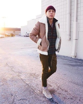 500+ Winter Outfits For Men: If you're on the hunt for a casual and at the same time stylish getup, try teaming a tan shearling jacket with brown cargo pants. For times when this ensemble appears too polished, play it down by sporting a pair of beige suede work boots. With a look like this in your winter sartorial collection, you'll manage to stay comfy and look amazing despite the extra cold temperatures.