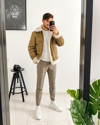 Shearling Jacket Outfits For Men: This casual pairing of a shearling jacket and brown plaid chinos can take on different forms according to the way it's styled. Go the extra mile and shake up your ensemble by wearing white leather low top sneakers.