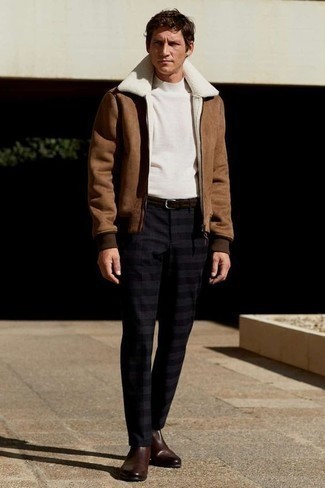 500+ Winter Outfits For Men: This combo of a brown shearling jacket and black horizontal striped chinos provides comfort and efficiency and helps keep it simple yet current. Infuse an element of refinement into your getup by slipping into a pair of dark brown leather chelsea boots. You know this combo is ideal to keep you warm and stylish all season long.
