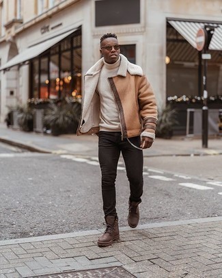 Brown Leather Work Boots Outfits For Men: This relaxed combination of a tan shearling jacket and black jeans is a foolproof option when you need to look stylish in a flash. Feeling inventive? Jazz things up by rounding off with a pair of brown leather work boots.