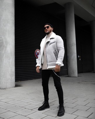 Beige Wool Turtleneck Outfits For Men: This off-duty combo of a beige wool turtleneck and black skinny jeans can take on different moods according to the way you style it. Kick up the formality of this outfit a bit by slipping into black leather casual boots.