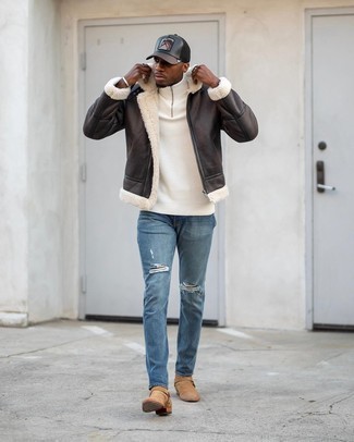 Tan Suede Chelsea Boots Outfits For Men: Wear a dark brown shearling jacket and blue ripped jeans for an easy-to-style menswear style. For a more refined touch, complement your outfit with a pair of tan suede chelsea boots.