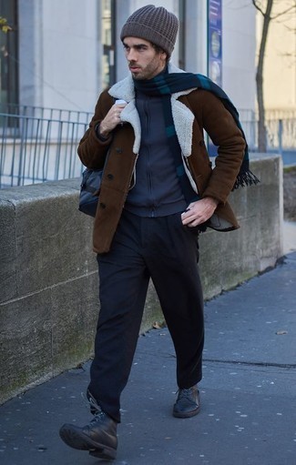Brown Shearling Jacket Outfits For Men: A brown shearling jacket and black chinos are the ideal way to introduce played down dapperness into your current lineup. Black leather casual boots tie the ensemble together.