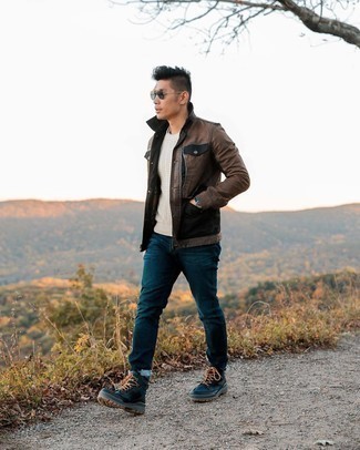 Tobacco Leather Shirt Jacket Outfits For Men: A tobacco leather shirt jacket and navy jeans will convey this casual and cool vibe. To bring out the fun side of you, introduce navy canvas work boots to your look.