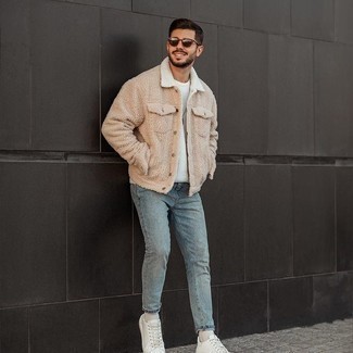 Beige Fleece Shirt Jacket Outfits For Men: A beige fleece shirt jacket and light blue jeans are absolute menswear must-haves if you're picking out a casual closet that holds to the highest sartorial standards. White leather low top sneakers will introduce a laid-back aesthetic to the getup.