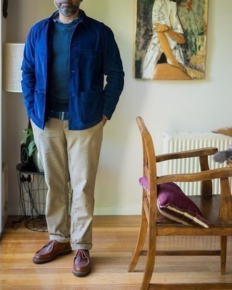 Blue Crew-neck Sweater Outfits For Men: A blue crew-neck sweater looks especially great when teamed with beige chinos. Complement your getup with brown leather desert boots and you're all set looking boss.