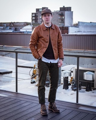 Tobacco Leather Shirt Jacket Outfits For Men: Exhibit your skills in menswear styling in this relaxed casual pairing of a tobacco leather shirt jacket and dark brown corduroy jeans. For maximum style points, complete this look with dark brown leather casual boots.