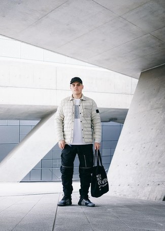 Black Print Canvas Tote Bag Outfits For Men: To pull together a laid-back menswear style with an edgy spin, you can easily rock a grey quilted shirt jacket and a black print canvas tote bag. The whole look comes together wonderfully if you add a pair of blue athletic shoes to the equation.