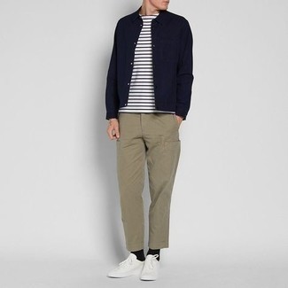 Navy Shirt Jacket Spring Outfits For Men: This pairing of a navy shirt jacket and khaki cargo pants is the ultimate off-duty style for any gentleman. A trendy pair of white canvas low top sneakers is an easy way to inject a sense of stylish casualness into your getup. Spring calls for seriously stylish looks just like this one.