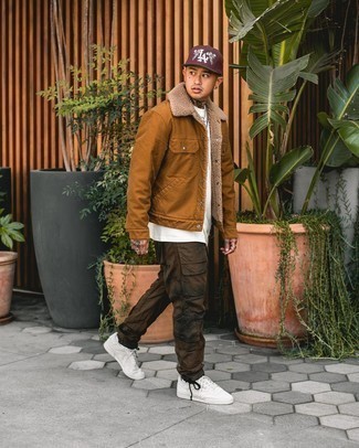 Tobacco Shirt Jacket Outfits For Men: This relaxed combo of a tobacco shirt jacket and dark brown tie-dye cargo pants comes in handy when you need to look dapper but have zero time. If you're hesitant about how to finish off, grab a pair of white canvas low top sneakers.