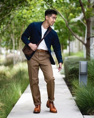 Brown Chinos with Navy Shirt Jacket Outfits: Rock a navy shirt jacket with brown chinos for a clean elegant ensemble. Complement this outfit with a pair of tobacco leather casual boots et voila, the outfit is complete.