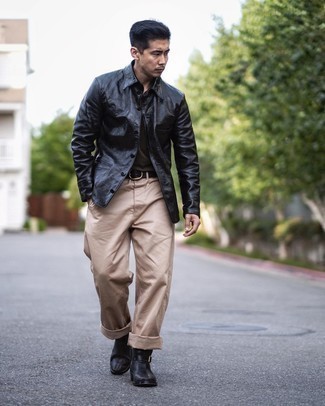 Black Leather Shirt Jacket Outfits For Men: Rock a black leather shirt jacket with khaki chinos if you wish to look dapper without exerting much effort. And if you want to effortlessly smarten up this look with shoes, complement your getup with black leather chelsea boots.