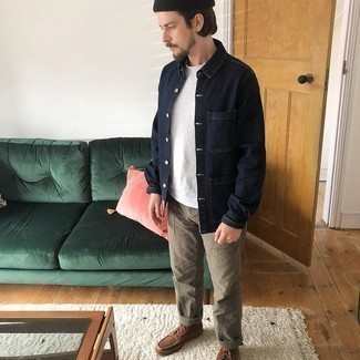 Boots Outfits For Men: For an outfit that's very simple but can be styled in a variety of different ways, dress in a navy denim shirt jacket and brown chinos. Boots integrate effortlessly within plenty of outfits.