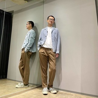 Light Blue Shirt Jacket Outfits For Men: Team a light blue shirt jacket with khaki chinos and you'll look incredibly sharp anywhere anytime. And if you need to instantly dress down this look with one single piece, complement your look with a pair of olive canvas low top sneakers.