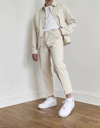 Beige Shirt Jacket Outfits For Men: This pairing of a beige shirt jacket and beige chinos falls somewhere between dressy and casual. A pair of white leather low top sneakers brings just the right amount of visual interest to this outfit.