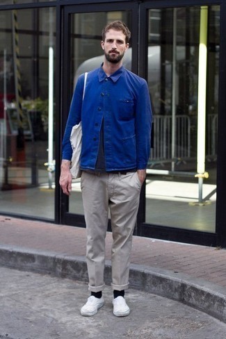 Blue Shirt Jacket Outfits For Men: This combination of a blue shirt jacket and grey chinos is great for dressier settings. For something more on the daring side to finish your look, complement this outfit with white canvas low top sneakers.