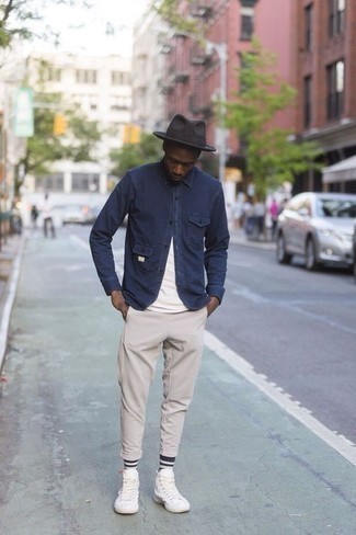 Beige Chinos Spring Outfits: A navy shirt jacket and beige chinos are worth being on your list of must-have menswear items. Feeling adventerous today? Spice up this outfit by wearing white canvas high top sneakers. This one will play especially well when spring comes.