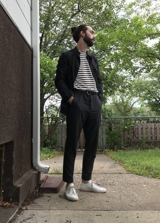 White and Black Crew-neck T-shirt Outfits For Men: A white and black crew-neck t-shirt and black chinos matched together are the perfect ensemble for those dressers who love off-duty outfits. A pair of white canvas low top sneakers will pull your whole ensemble together.