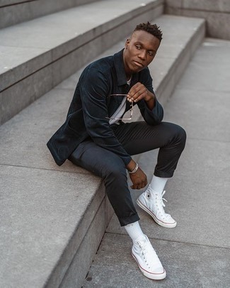 White Canvas High Top Sneakers Outfits For Men: Make a navy corduroy shirt jacket and black chinos your outfit choice to don a proper and refined ensemble. Complement this look with white canvas high top sneakers to easily turn up the wow factor of your ensemble.