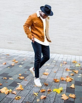 Brown Corduroy Shirt Jacket Outfits For Men: You'll be amazed at how very easy it is for any guy to get dressed like this. Just a brown corduroy shirt jacket combined with navy chinos. Feeling transgressive? Switch up this look by finishing with white canvas low top sneakers.