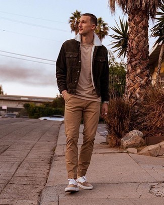 Brown Corduroy Shirt Jacket Outfits For Men: Such pieces as a brown corduroy shirt jacket and khaki chinos are an easy way to introduce a sense of rugged refinement into your current lineup. Bring a playful vibe to your ensemble with a pair of tan suede low top sneakers.
