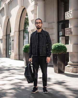 Black Leather Backpack Outfits For Men: A black and white vertical striped shirt jacket and a black leather backpack are a street style combo that every style-savvy gent should have in his casual arsenal. Add black and white athletic shoes to the equation and the whole ensemble will come together brilliantly.