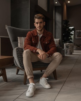 Tobacco Corduroy Shirt Jacket Outfits For Men: This pairing of a tobacco corduroy shirt jacket and beige chinos makes for the perfect base for a smart ensemble. Why not add a pair of white leather low top sneakers to the mix for a more relaxed touch?
