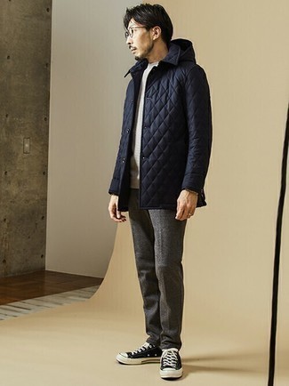 Navy Quilted Shirt Jacket Outfits For Men: This pairing of a navy quilted shirt jacket and charcoal wool chinos will be undeniable proof of your prowess in men's fashion even on lazy days. Bring an easy-going vibe to this outfit by wearing a pair of black and white canvas low top sneakers.