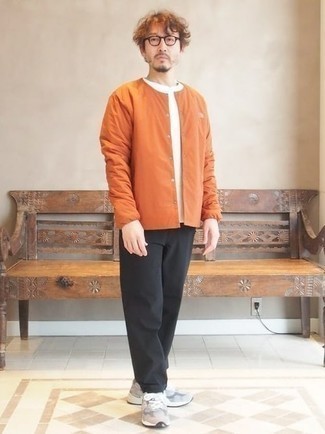 Orange Nylon Shirt Jacket Outfits For Men: This classic and casual pairing of an orange nylon shirt jacket and black chinos is extremely easy to throw together without a second thought, helping you look dapper and prepared for anything without spending too much time going through your wardrobe. Dial down the dressiness of this look by finishing with grey athletic shoes.