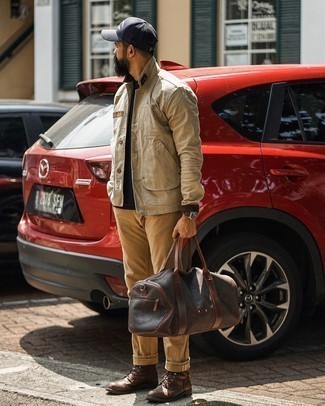 Brown Leather Duffle Bag Outfits For Men: This combo of a beige shirt jacket and a brown leather duffle bag looks amazing and makes any gent look instantly cooler. For a more polished spin, why not complete your ensemble with dark brown leather casual boots?
