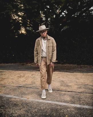 Hat Outfits For Men: Pairing a tan shirt jacket with a hat is an awesome choice for a casual but stylish look. And if you wish to easily step up your ensemble with one piece, add a pair of beige canvas low top sneakers to your outfit.