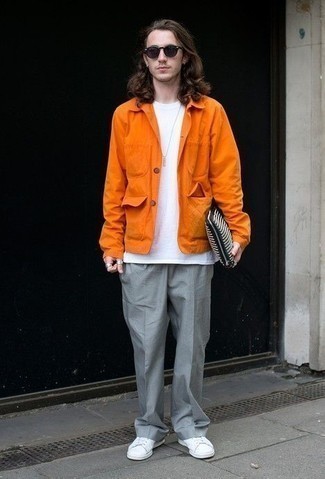 Zip Pouch Outfits For Men: Super stylish, this combination of an orange shirt jacket and a zip pouch will provide you with excellent styling possibilities. Up the formality of this ensemble a bit by finishing off with a pair of white canvas low top sneakers.