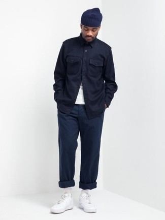 Navy Shirt Jacket Casual Outfits For Men: A navy shirt jacket and navy chinos are the perfect way to introduce a sense of masculine sophistication into your daily casual lineup. With footwear, go for something on the laid-back end of the spectrum and finish off this ensemble with white leather low top sneakers.