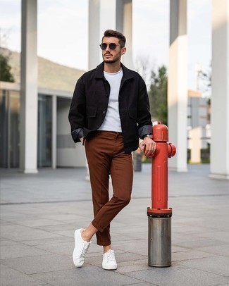 Black Shirt Jacket Outfits For Men: This combination of a black shirt jacket and brown chinos might pack a punch, but it's also very easy to wear. Does this getup feel all-too-perfect? Introduce a pair of white canvas low top sneakers to change things up a bit.