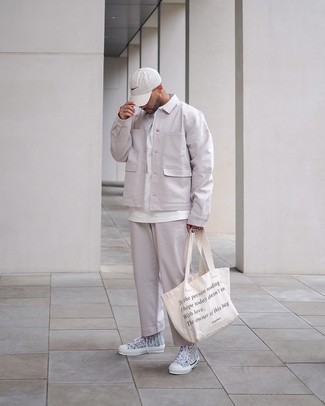 Beige Print Canvas Tote Bag Outfits For Men: A beige shirt jacket and a beige print canvas tote bag are a good combination to add to your daily casual arsenal. A pair of grey print canvas high top sneakers looks wonderful finishing this look.