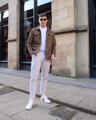 Brown Shirt Jacket Outfits For Men: This combination of a brown shirt jacket and beige chinos looks sophisticated, but in a cool kind of way. Our favorite of a myriad of ways to round off this ensemble is with white and black leather low top sneakers.